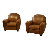 Paire de fauteuils club en cuir