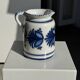 Artisan blue floral decorative carafe, height 17 cm, diameter 24.5 cm.