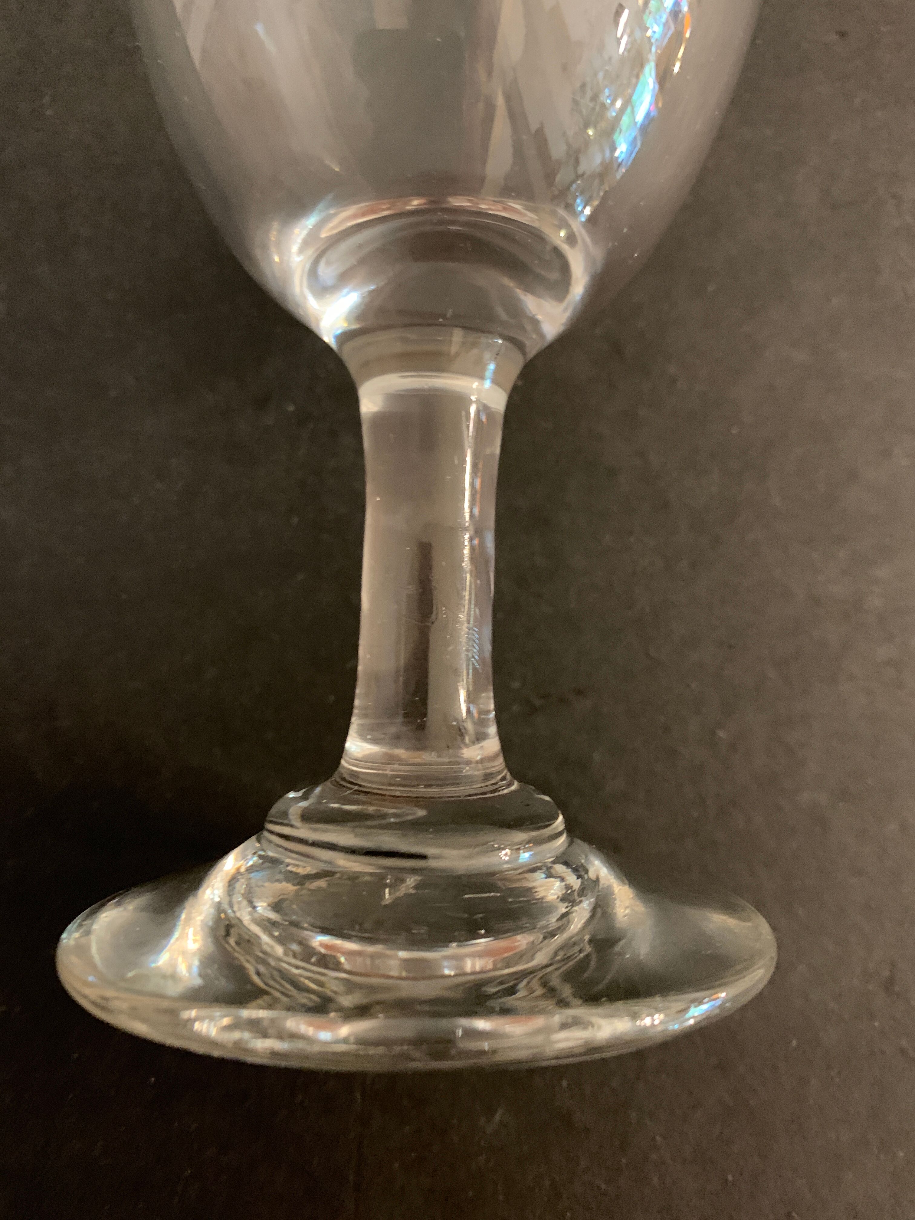 7 antique blown foot glasses