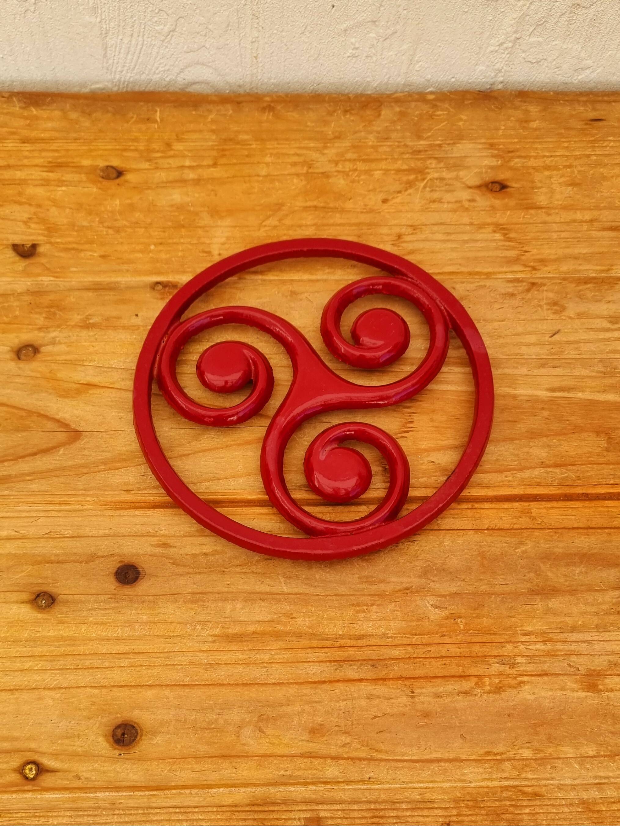 Triskelion cast iron trivet