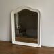 Antique mirror with a gendarme hat shape. White. 72x56.