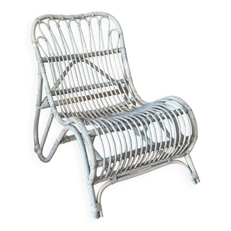 Vintage curved rattan armchair. 1970.