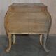 Pair of curved walnut commodes with marquetry and marble tops.