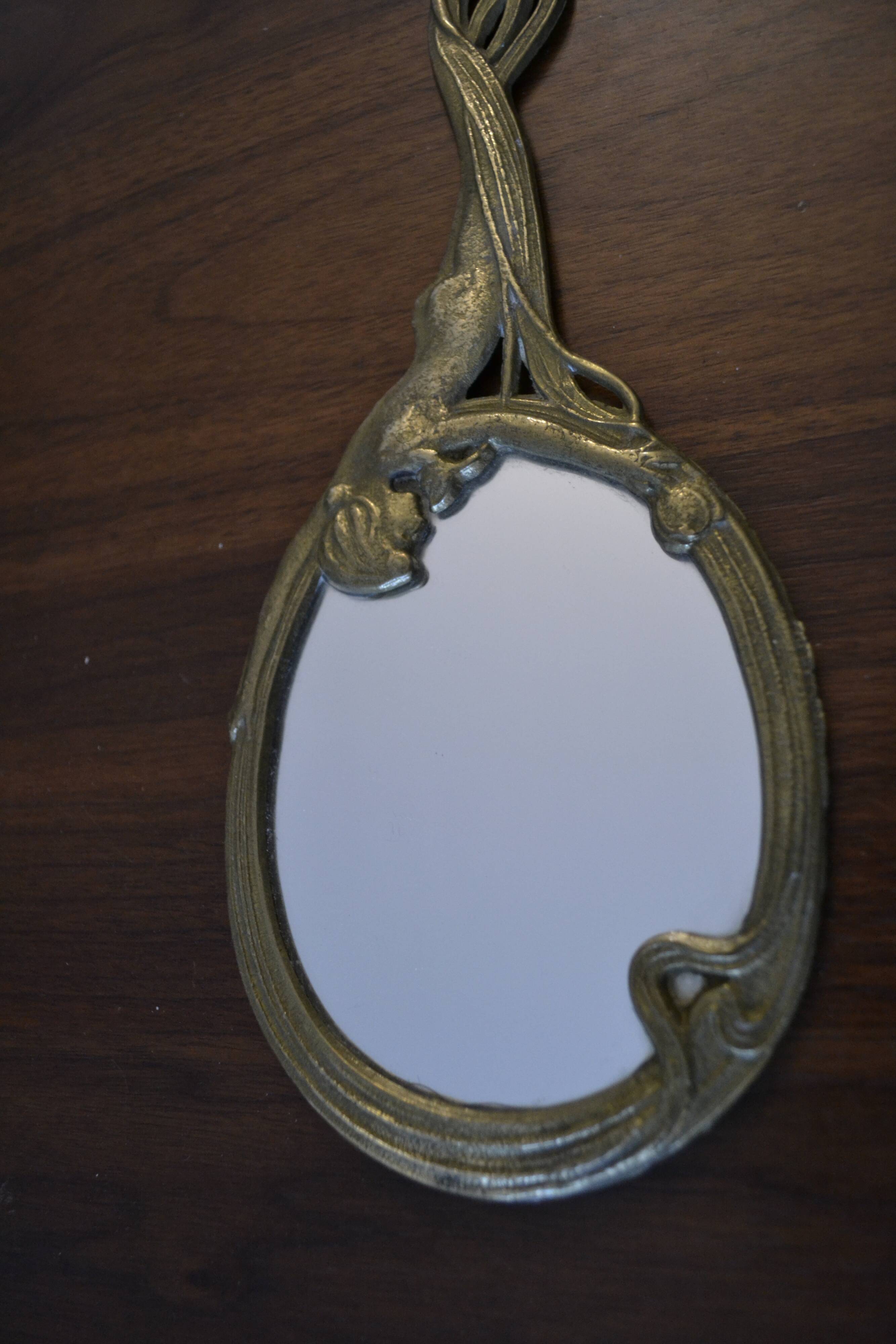 Brass hand "nymph" mirror