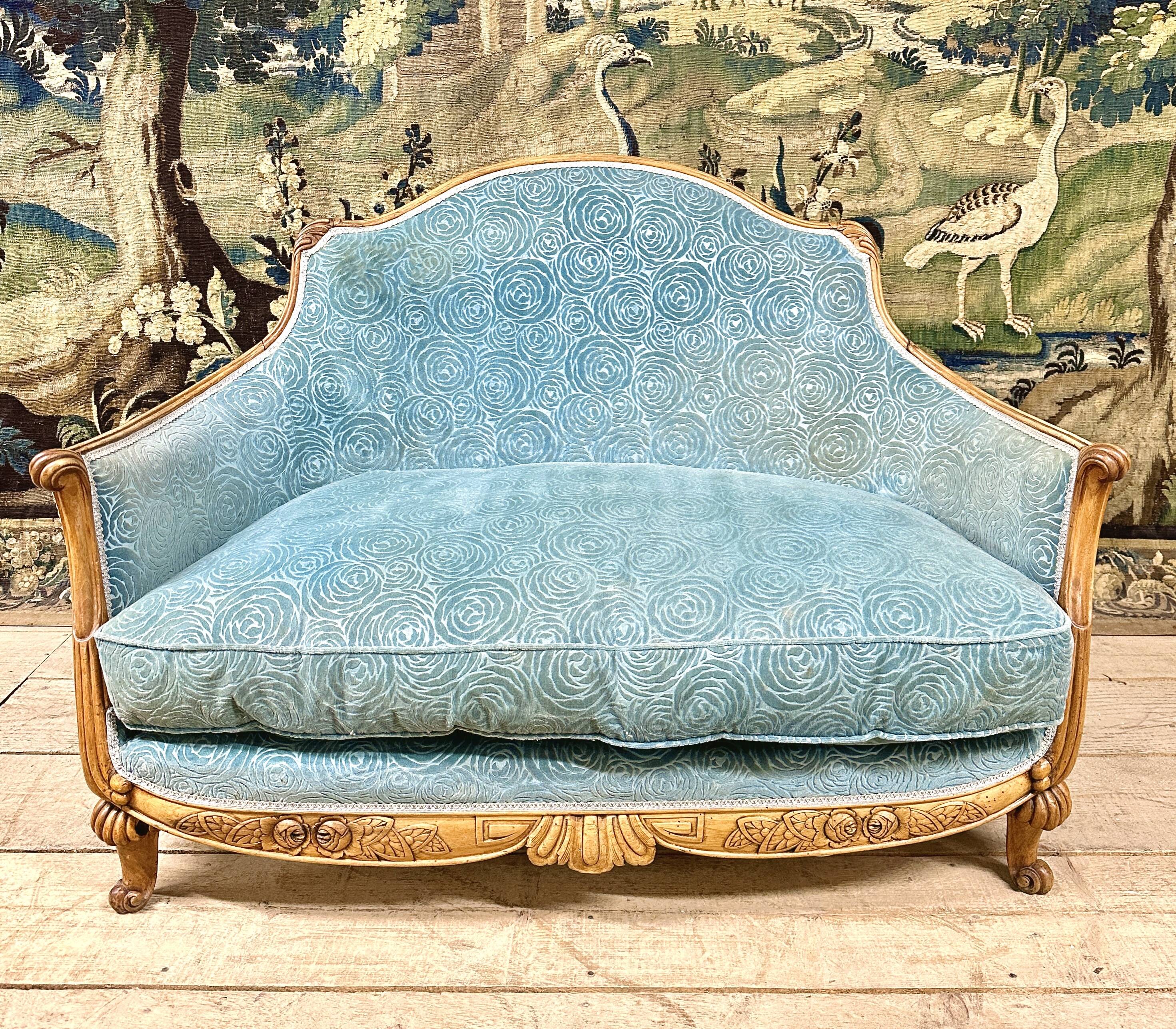Art deco living room around 1920 in carved wood upholstered in blue velvet, a sofa two armchairs