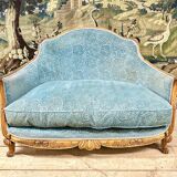 Art deco living room around 1920 in carved wood upholstered in blue velvet, a sofa two armchairs