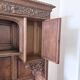 Large secretary with a drop-down front in carved oak, neo-Renaissance style.