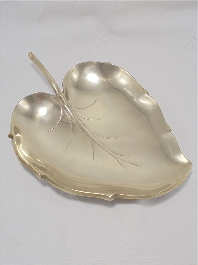 Brass pocket emptier