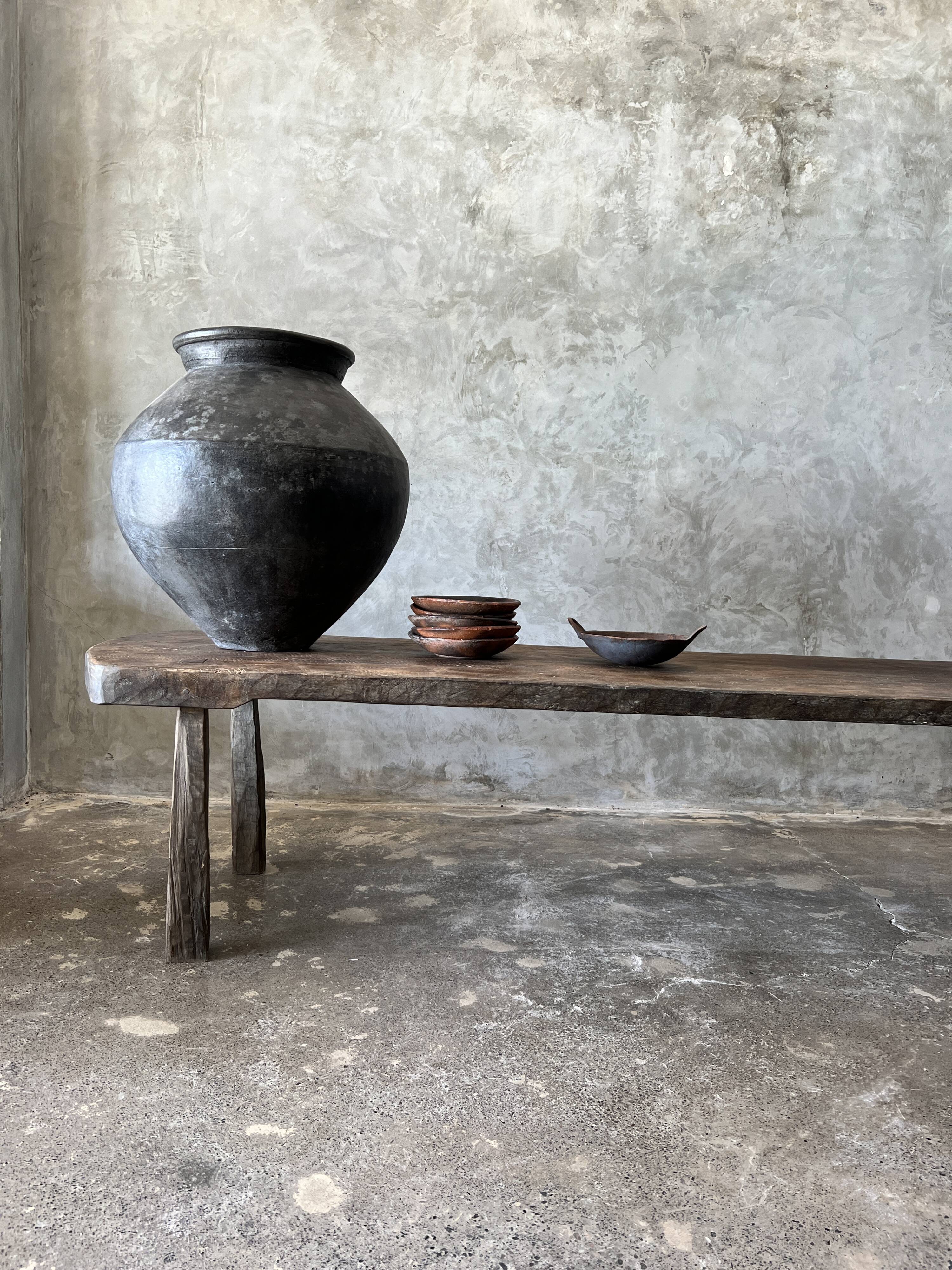 Large rounded coffee table in old Asian teak