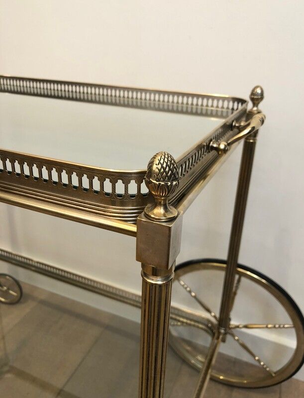Neoclassical style rolling table in silvered brass