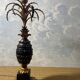 Large pineapple table lamp in carved black and gold wood, France, early 20th century.