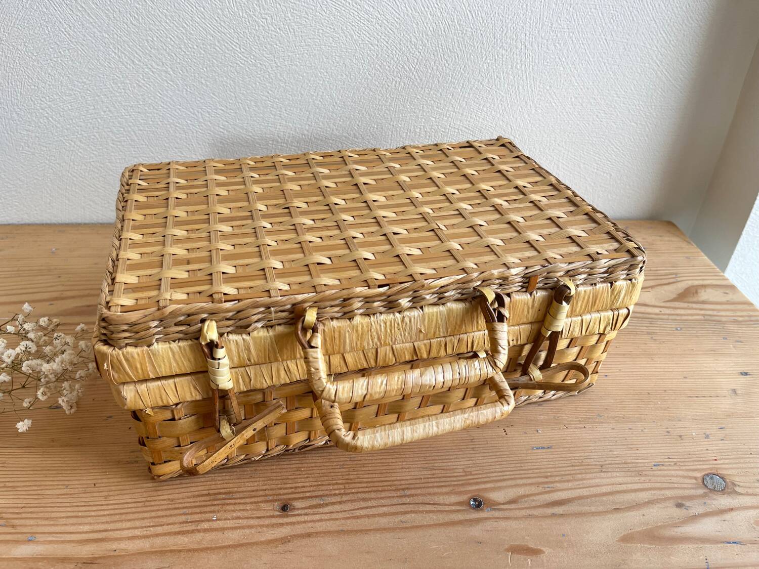 Vintage woven wicker suitcase