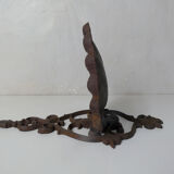 Old cast iron planter shell-shaped plant support