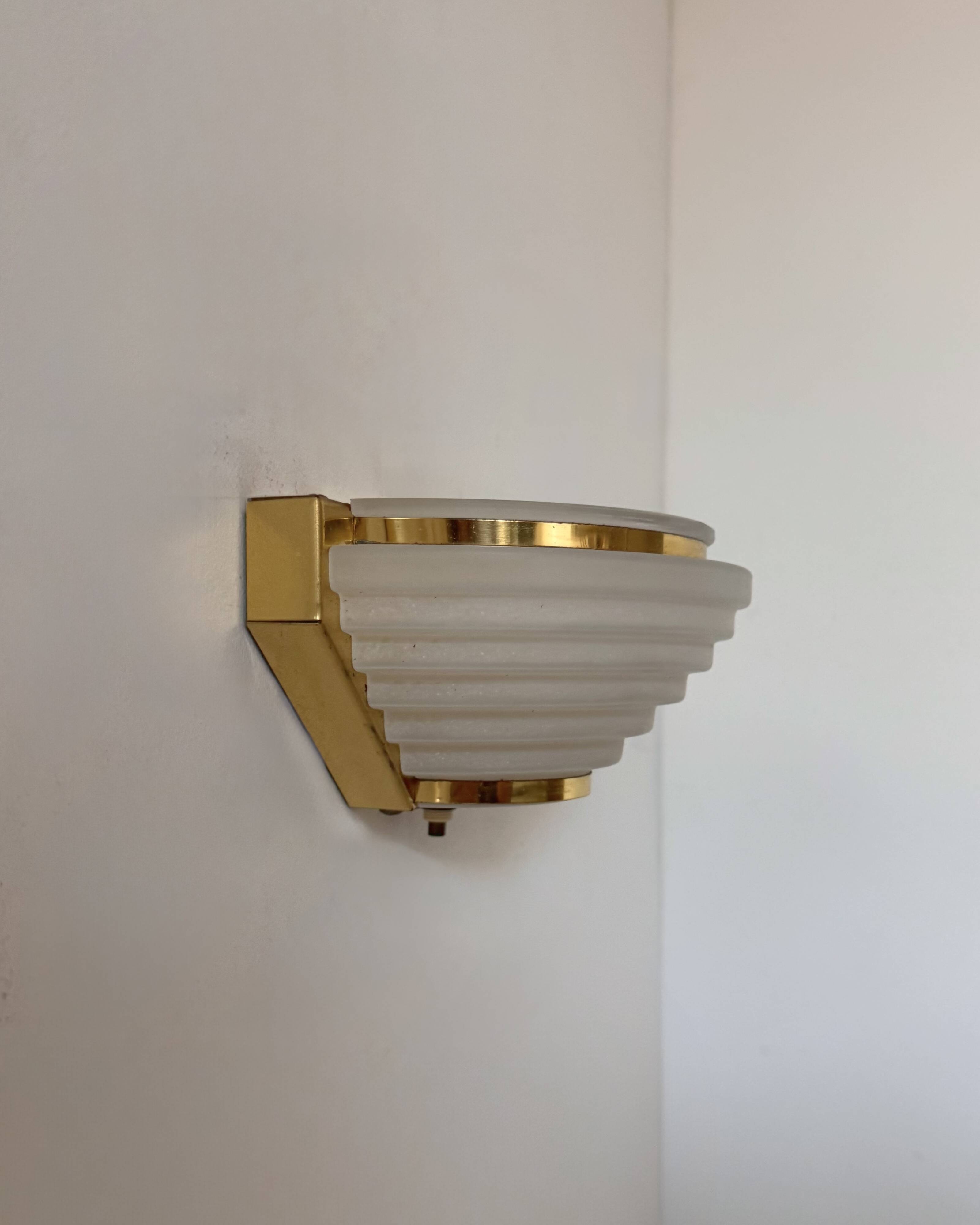 Pair of vintage brass and frosted glass wall lights, France, 1970.