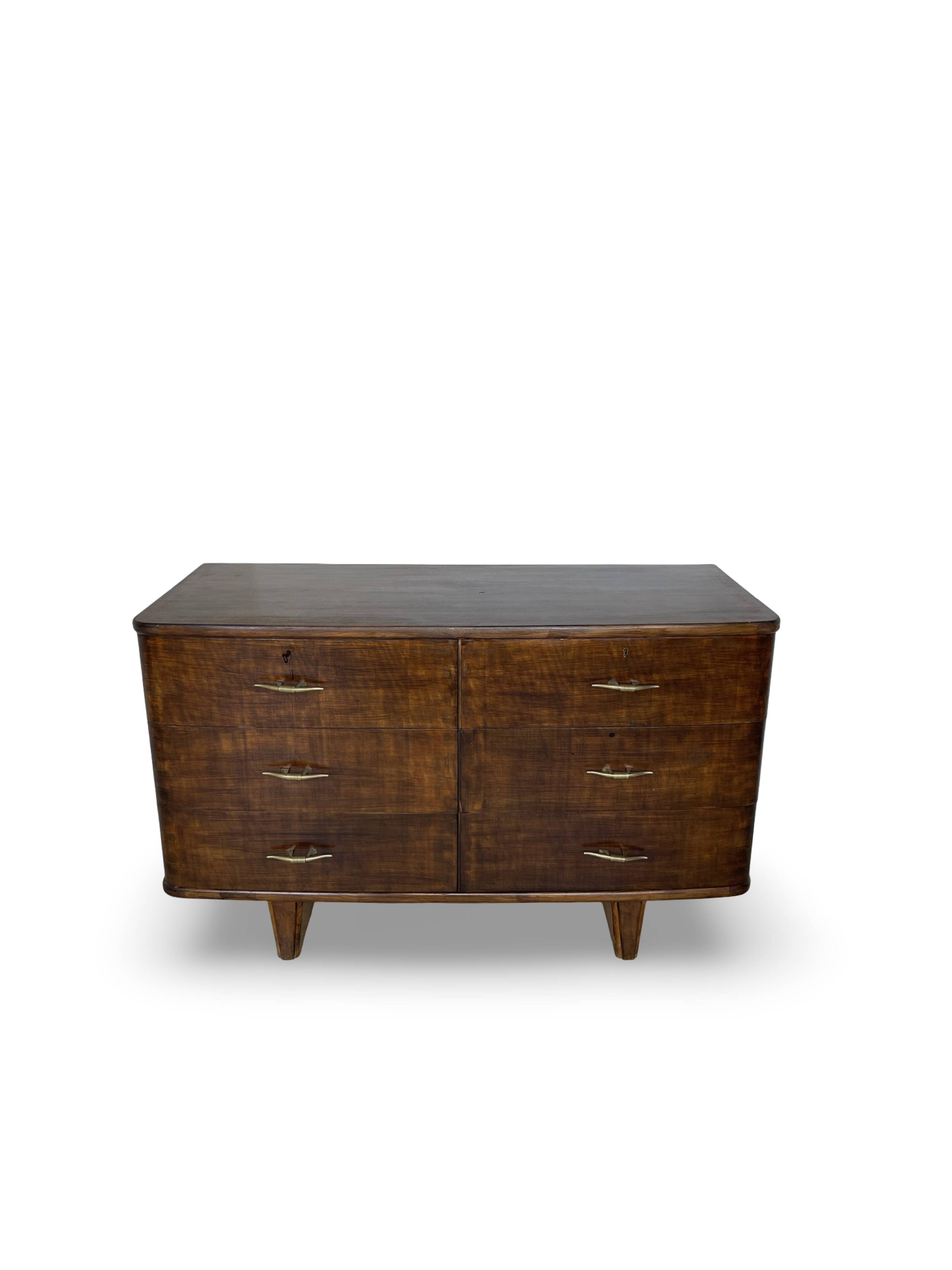 A vintage Italian chest of drawers, made of veneered walnut and solid wood,