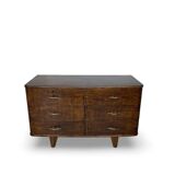 A vintage Italian chest of drawers, made of veneered walnut and solid wood,