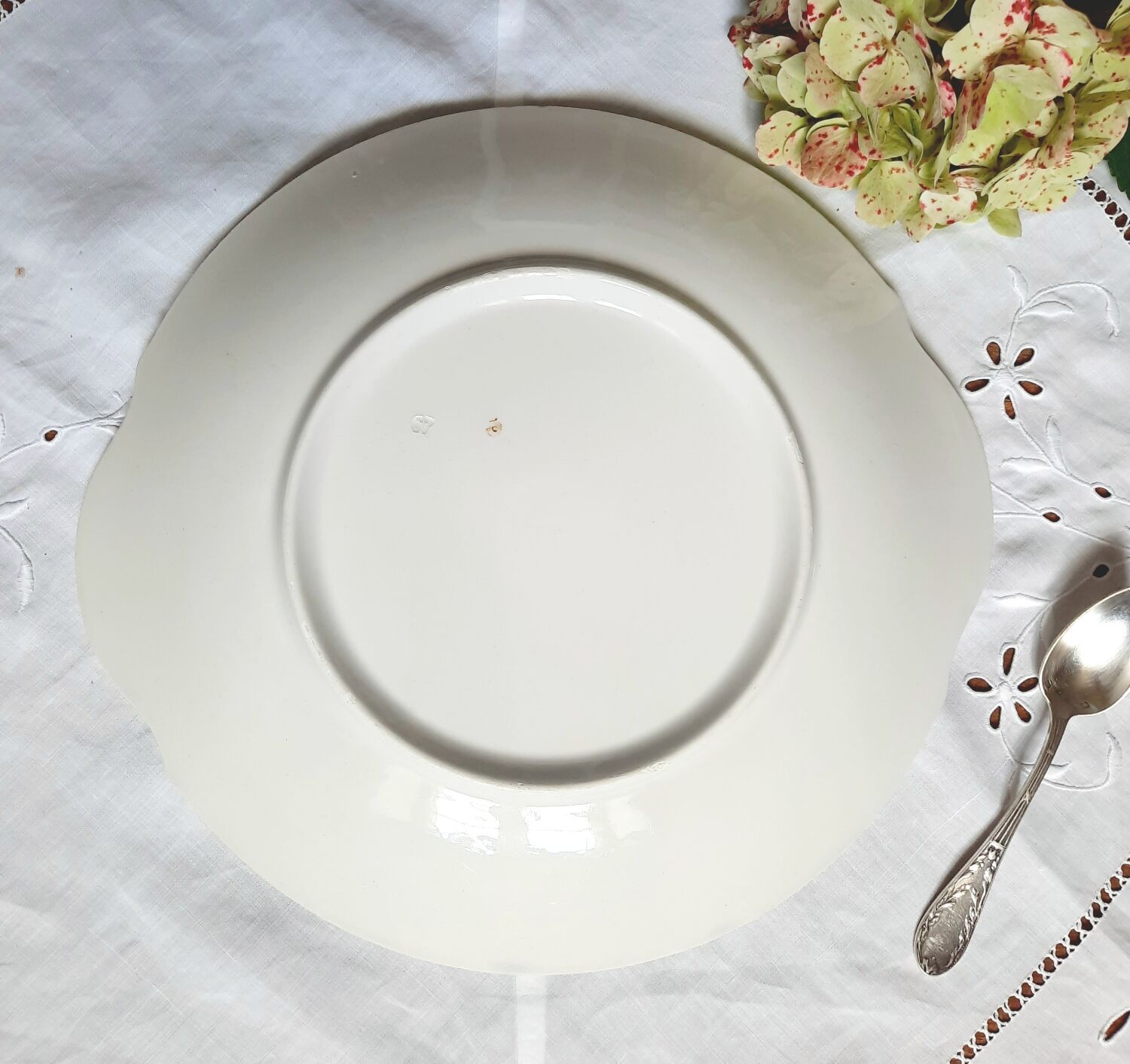 Mismatched old dessert plates accompanied by a dish