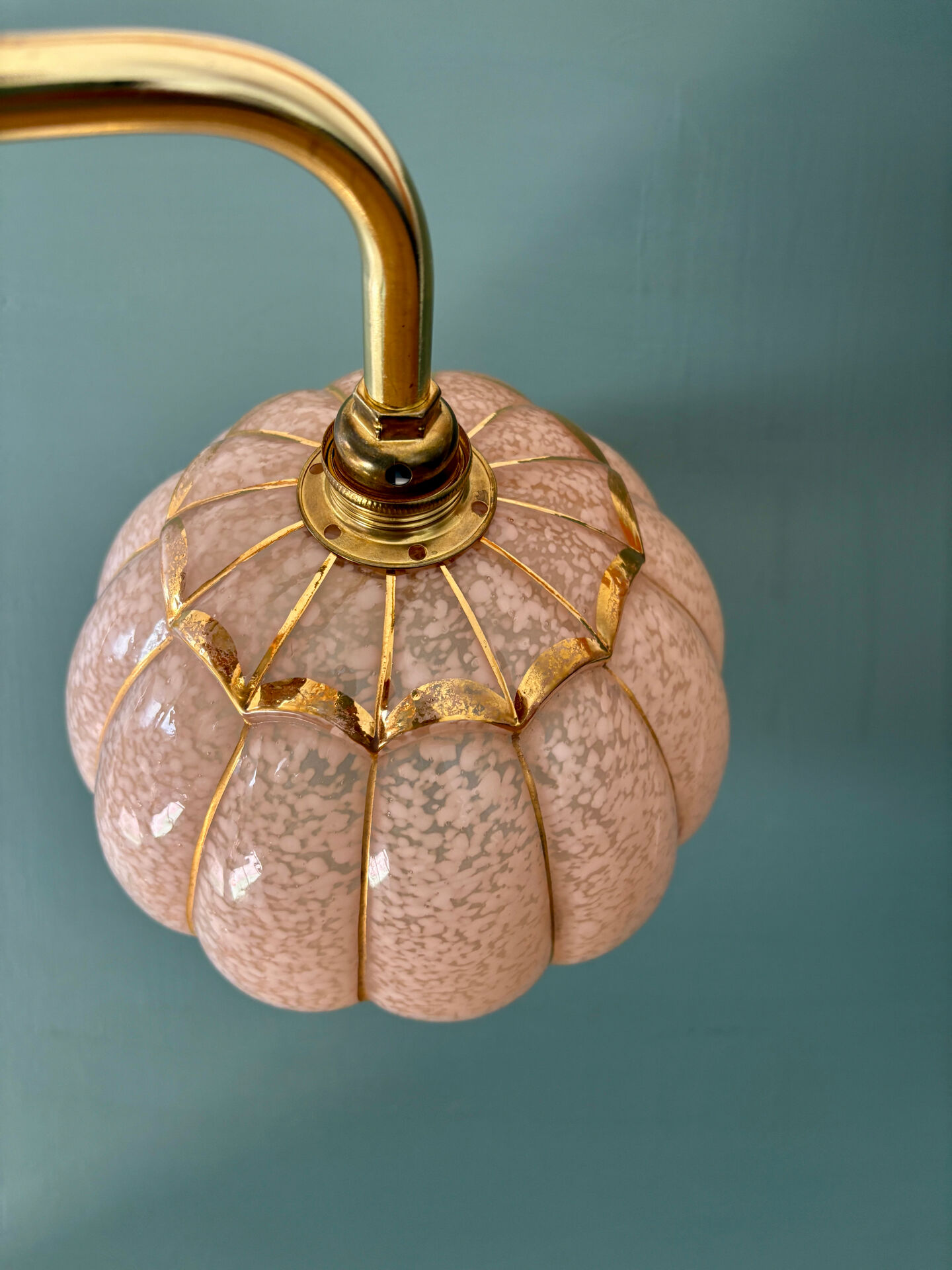 Vintage glass wall light with a pink and gold Clichy globe.