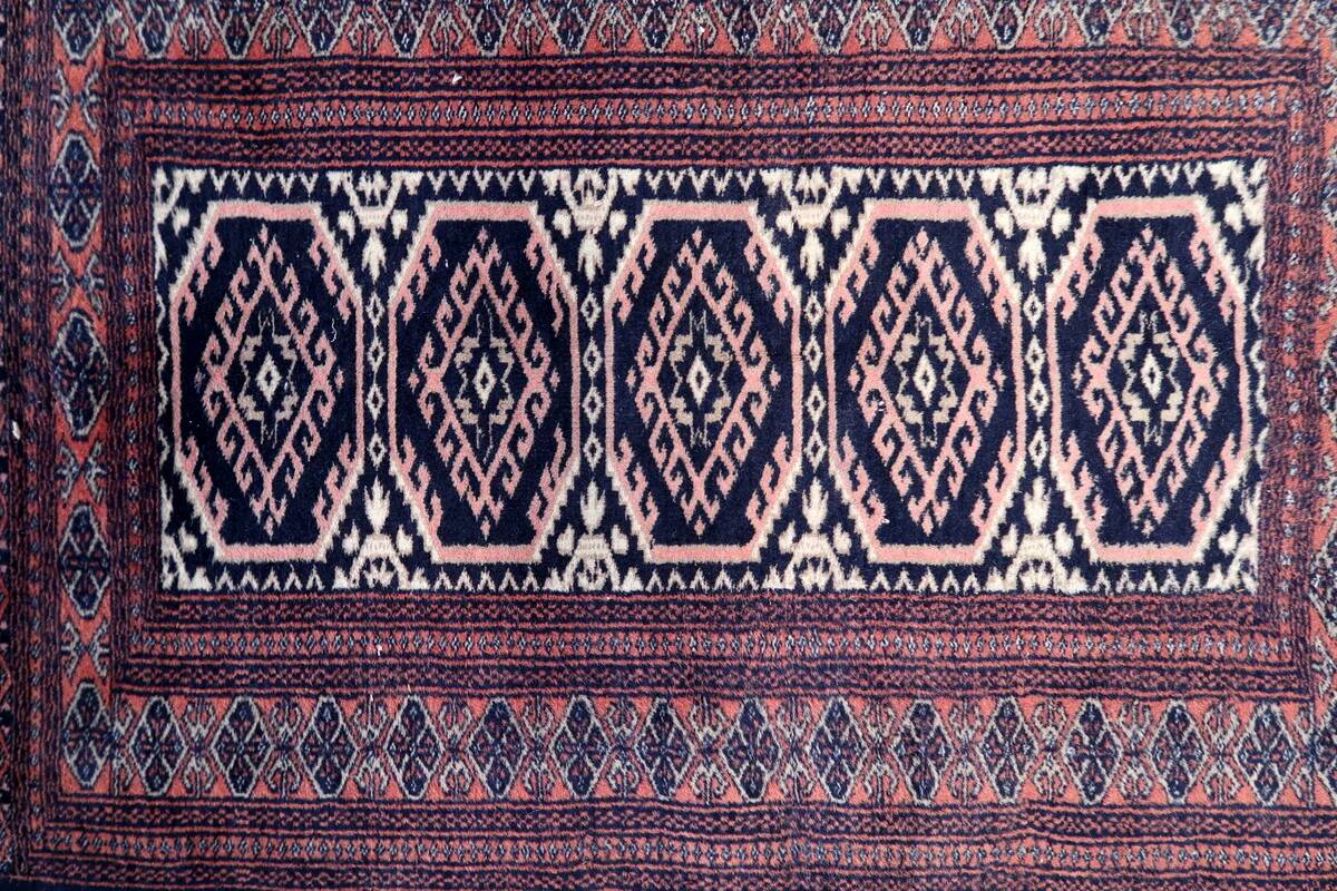 Handmade vintage 1960s Uzbek Bukhara rug – small wool tribal carpet (65cm x 95cm)