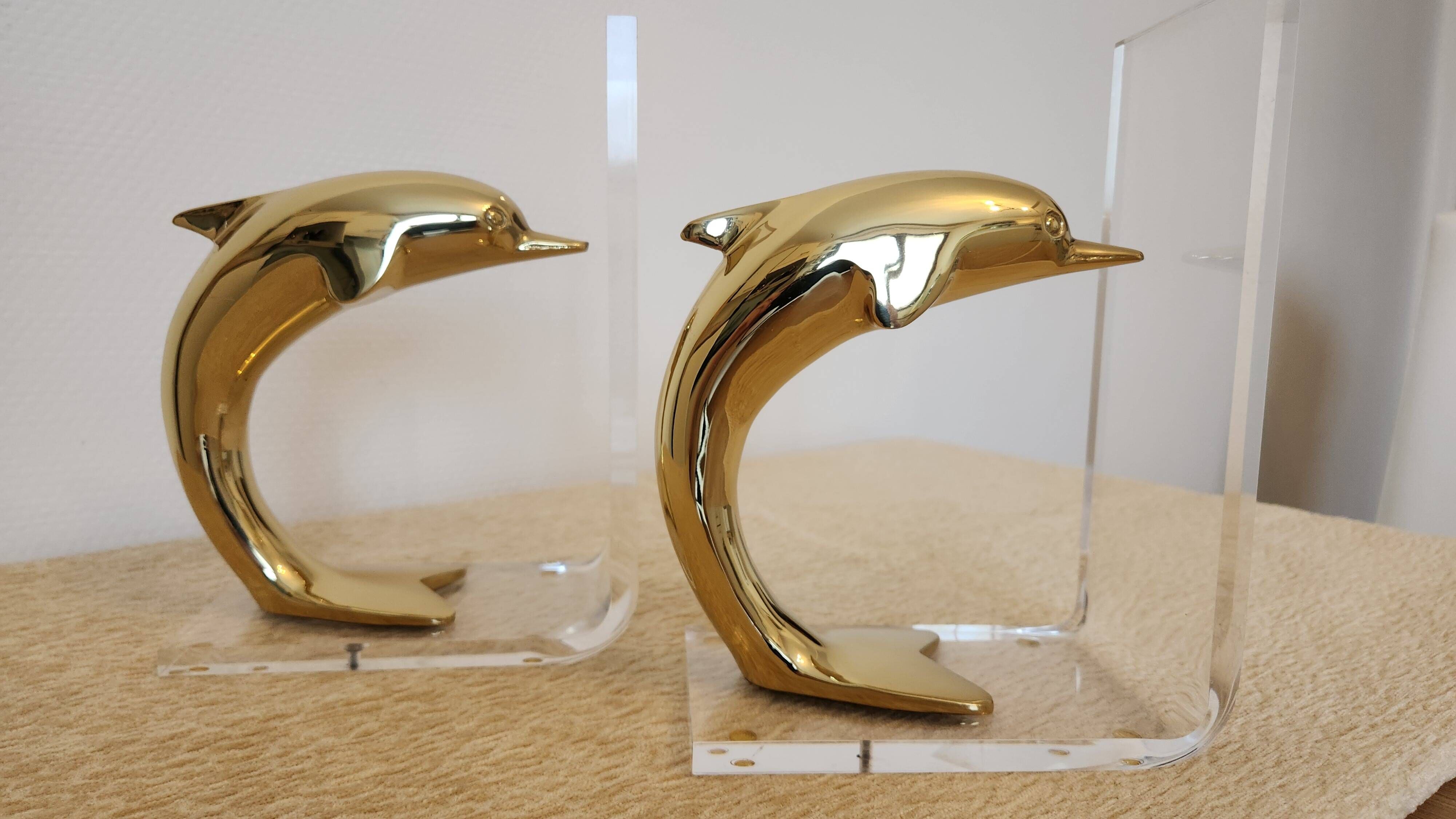 Dolphin bookends in gold metal and plexiglass – 1980s