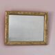 Rectangular wooden mirror with ornate Art Nouveau gold finish.