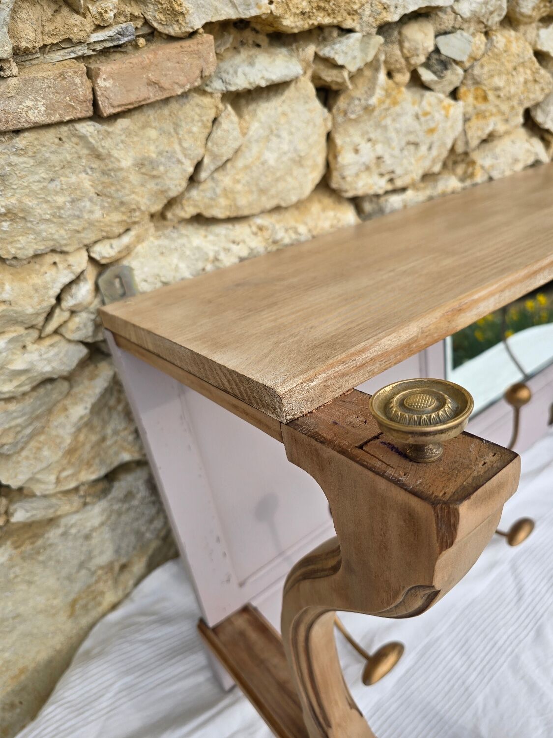 Coat rack or wall-mounted entrance wardrobe with scroll arms and antique hooks.