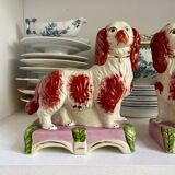 Pair of Staffordshire porcelain Cavalier King Charles dogs on terrace, 19th century.