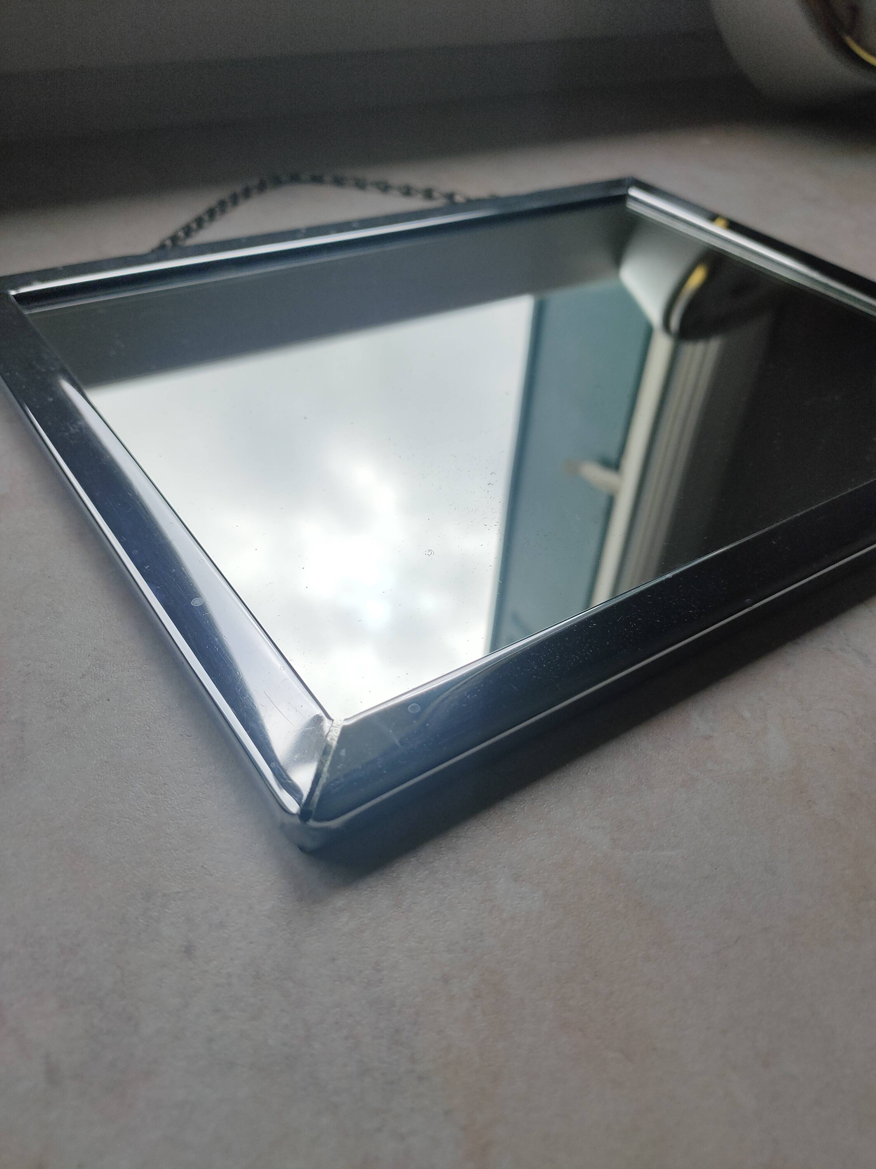 Barber mirror with chain.