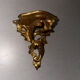 Antique wall-mounted console in gilded wood in rococo style.