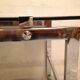 Table basse sur roulette 1970 chrome et verre fumé