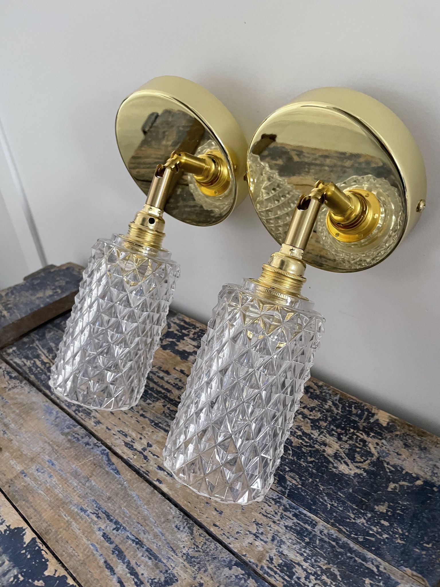 Pair of vintage electrified glass wall lamps