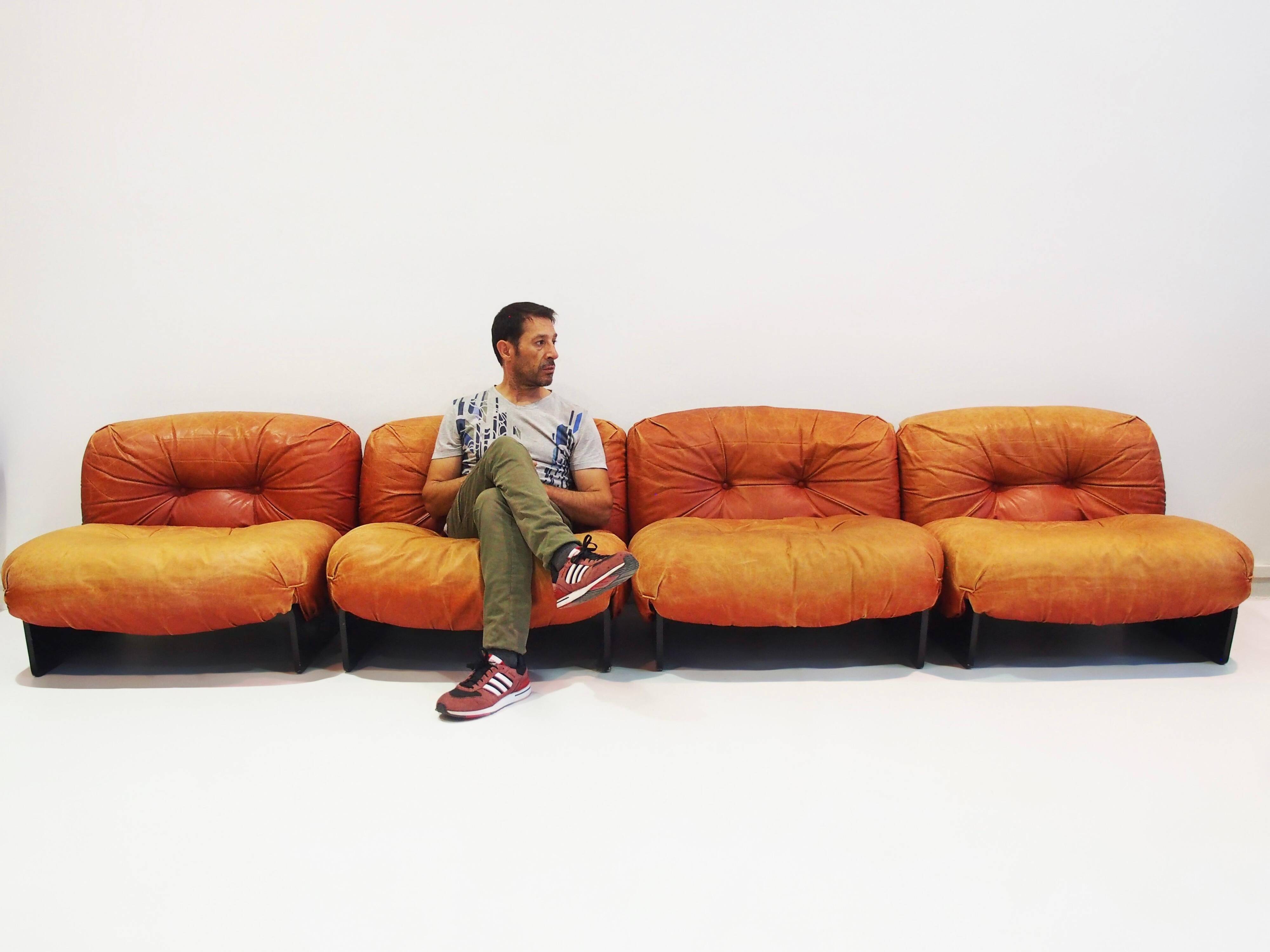 Set of four modular sun loungers by Giuseppe Munari upholstered in cognac leather.