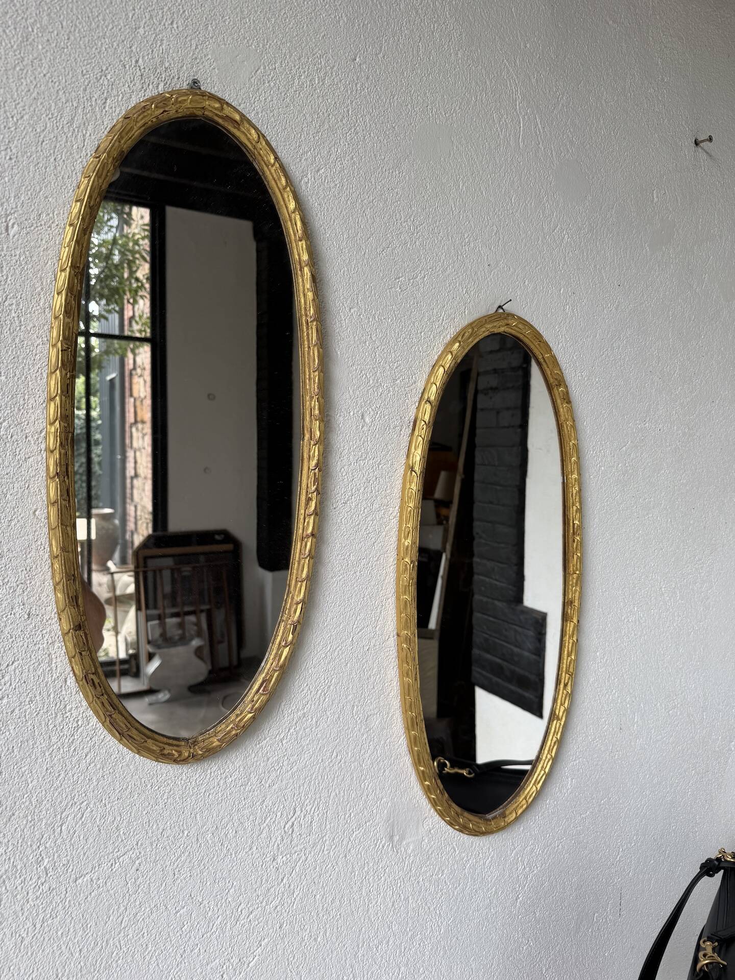 Pair of oval mirrors 1900 gilded stucco