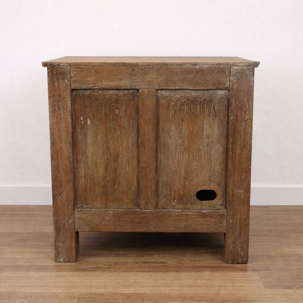 Oak side cabinet with carved motifs