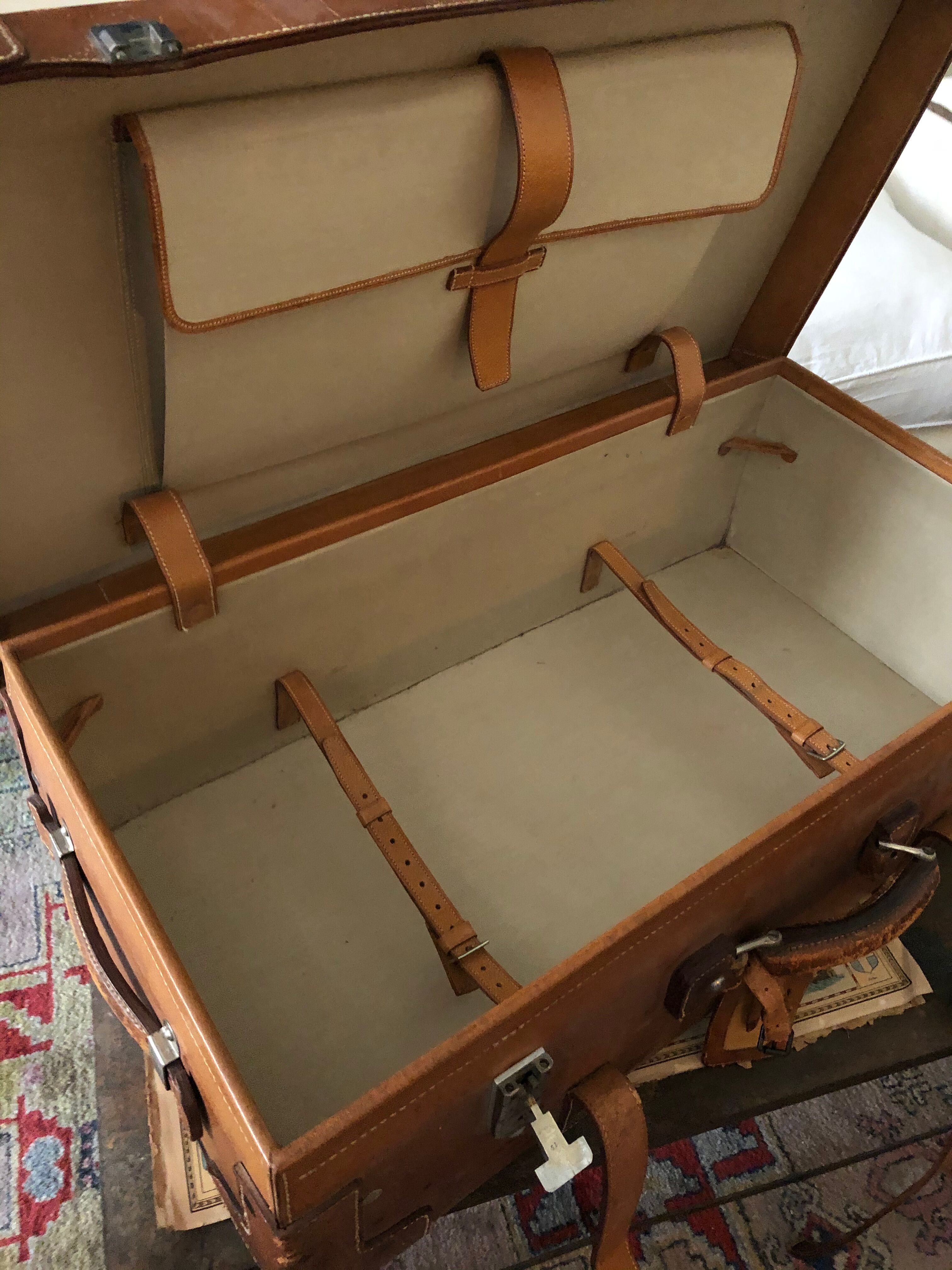 Former leather trunk with Louis Vuitton label holder