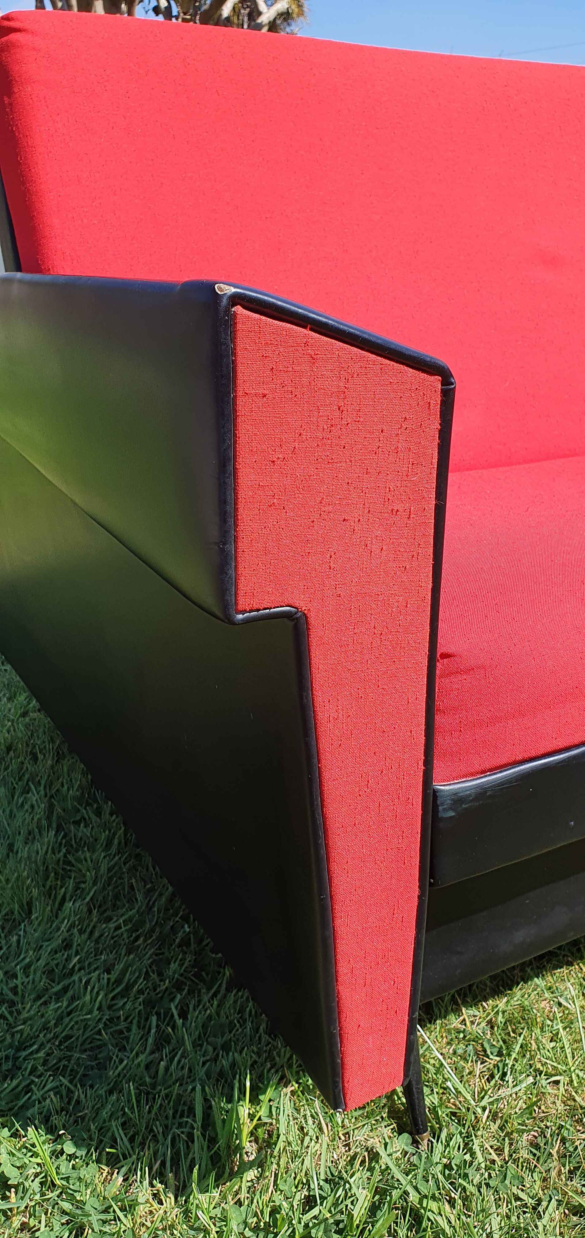 Vintage sofa 3 places convertible, red fabric and black skaï.1960s.