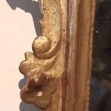Ancienne paire de miroirs en bois sculpté et doré