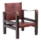 “Safari” armchair in wood and cognac leather. 1960s/70s.