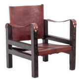 Fauteuil « Safari » en bois et cuir cognac. Années 1960/70.