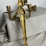 Deux bougeoirs muraux en bronze style Empire