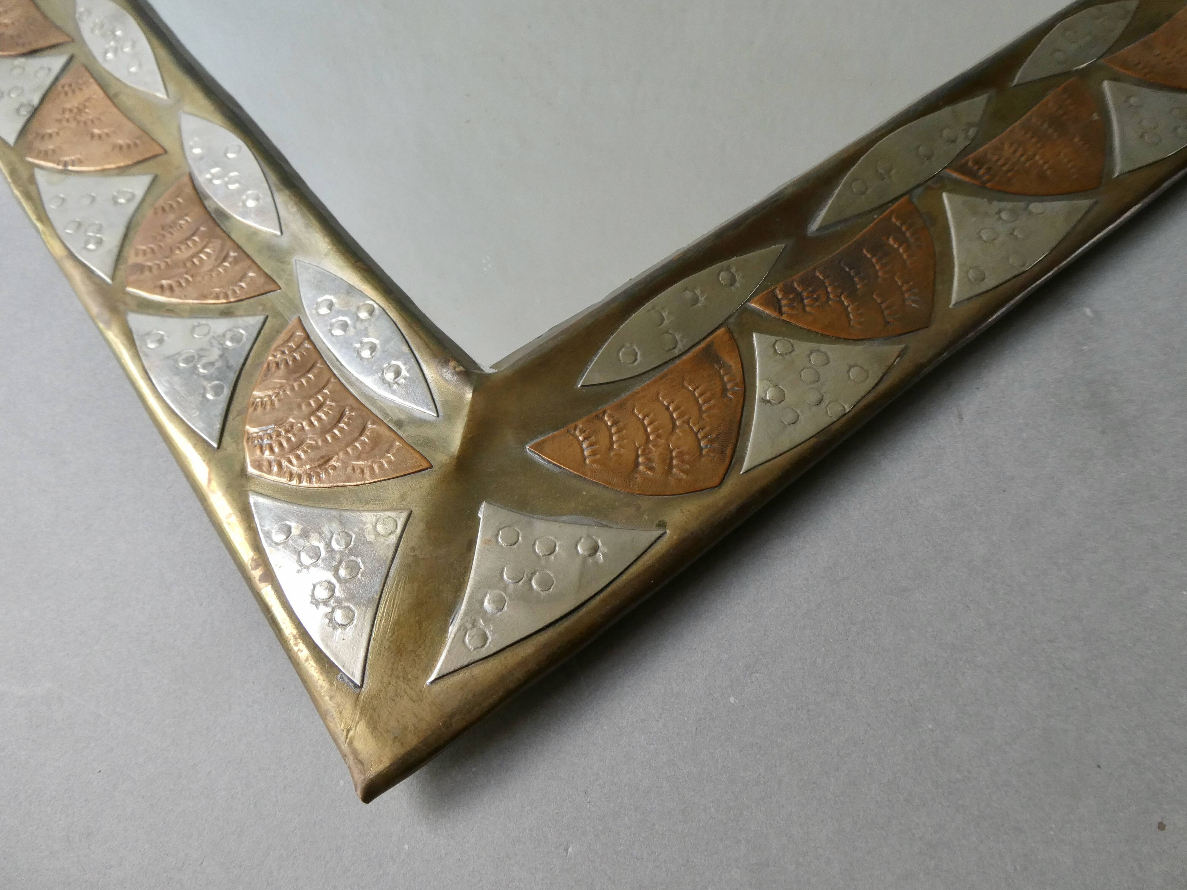 Moroccan mirror in chiseled brass, copper and silver, 70s-80s