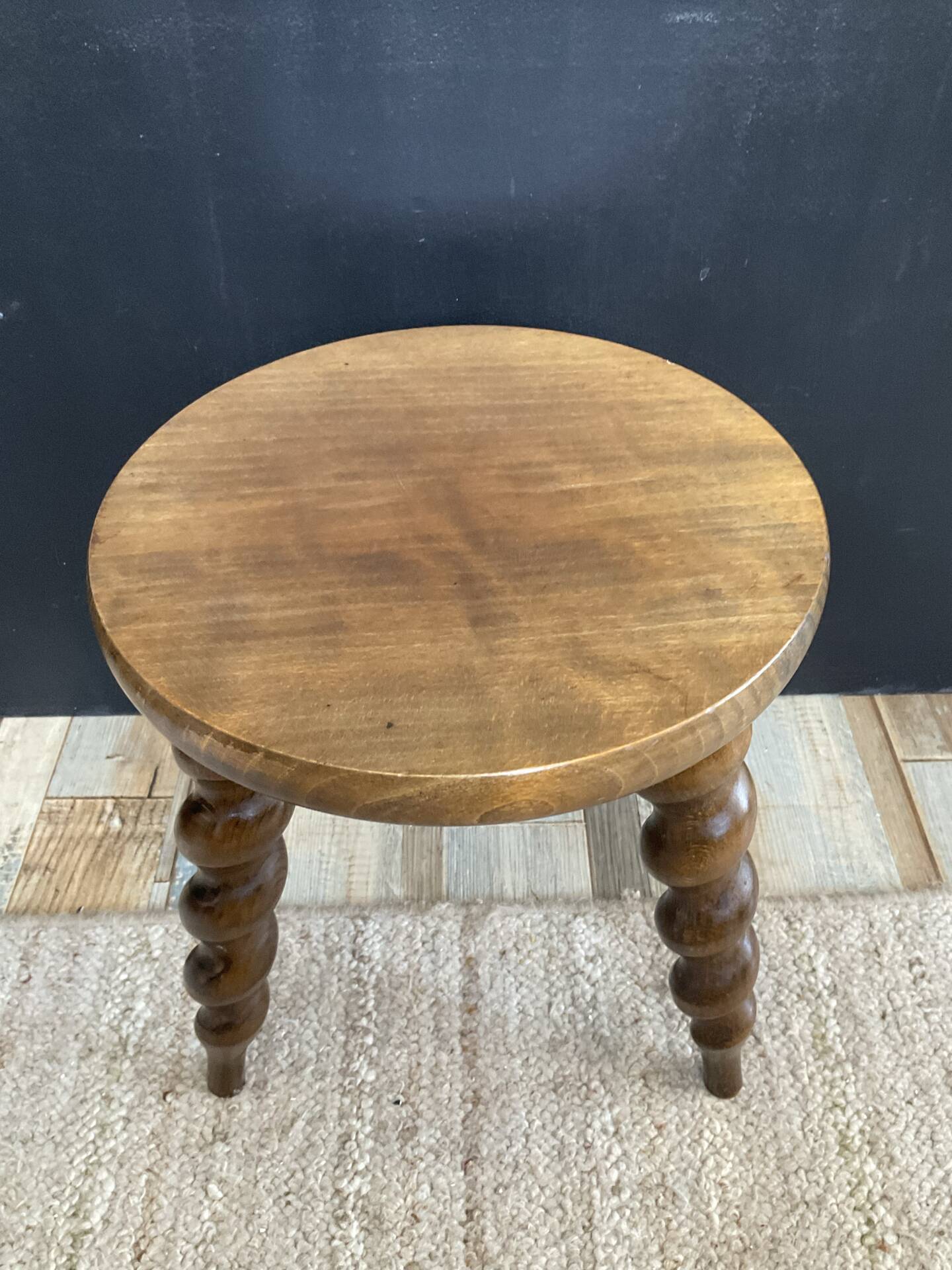 Antique tripod stool made of turned wood
