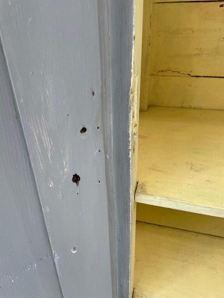 Blue patinated cap cabinet
