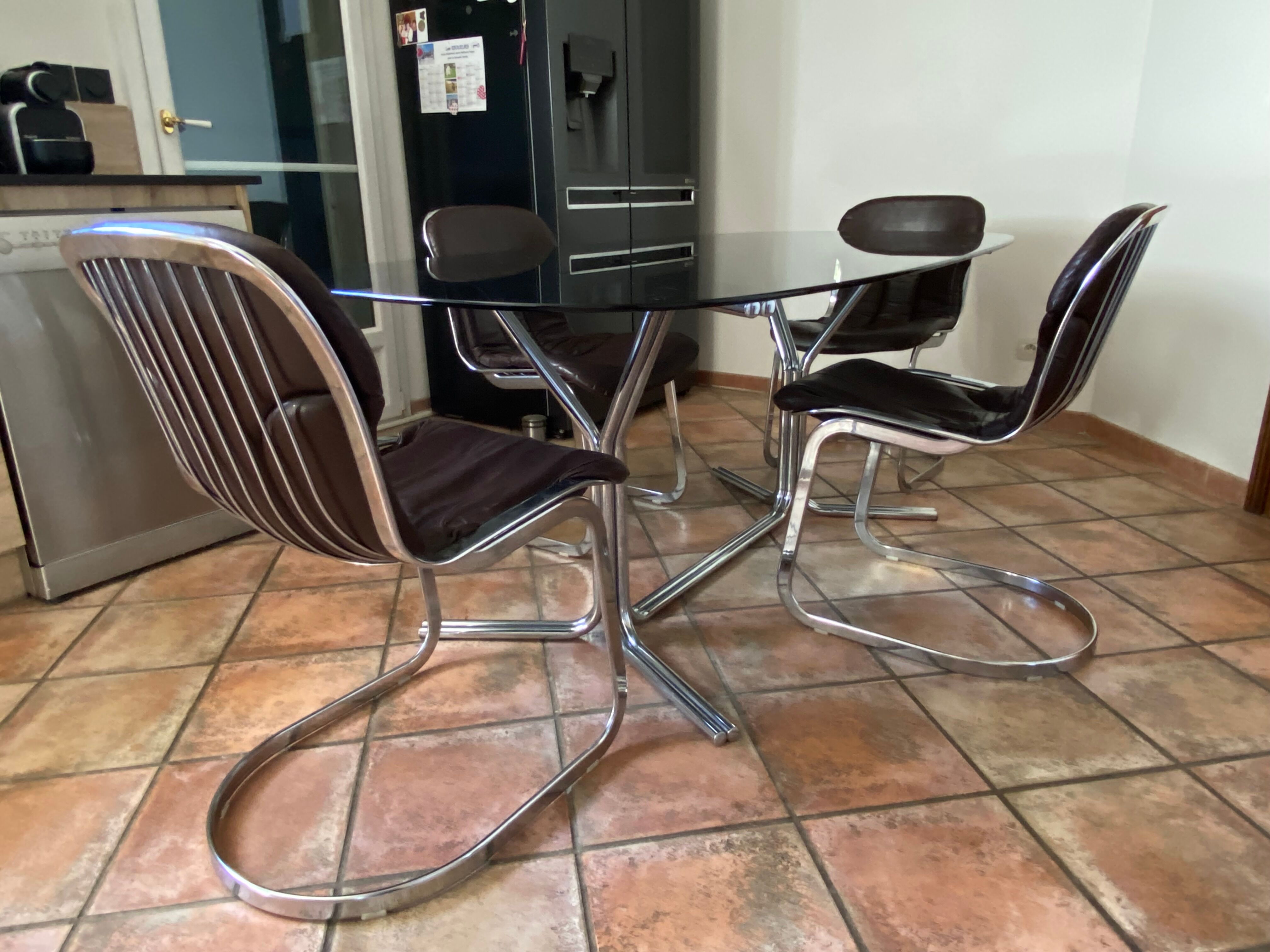 Oval table. 1970. Steel and smoked glass. 180x100