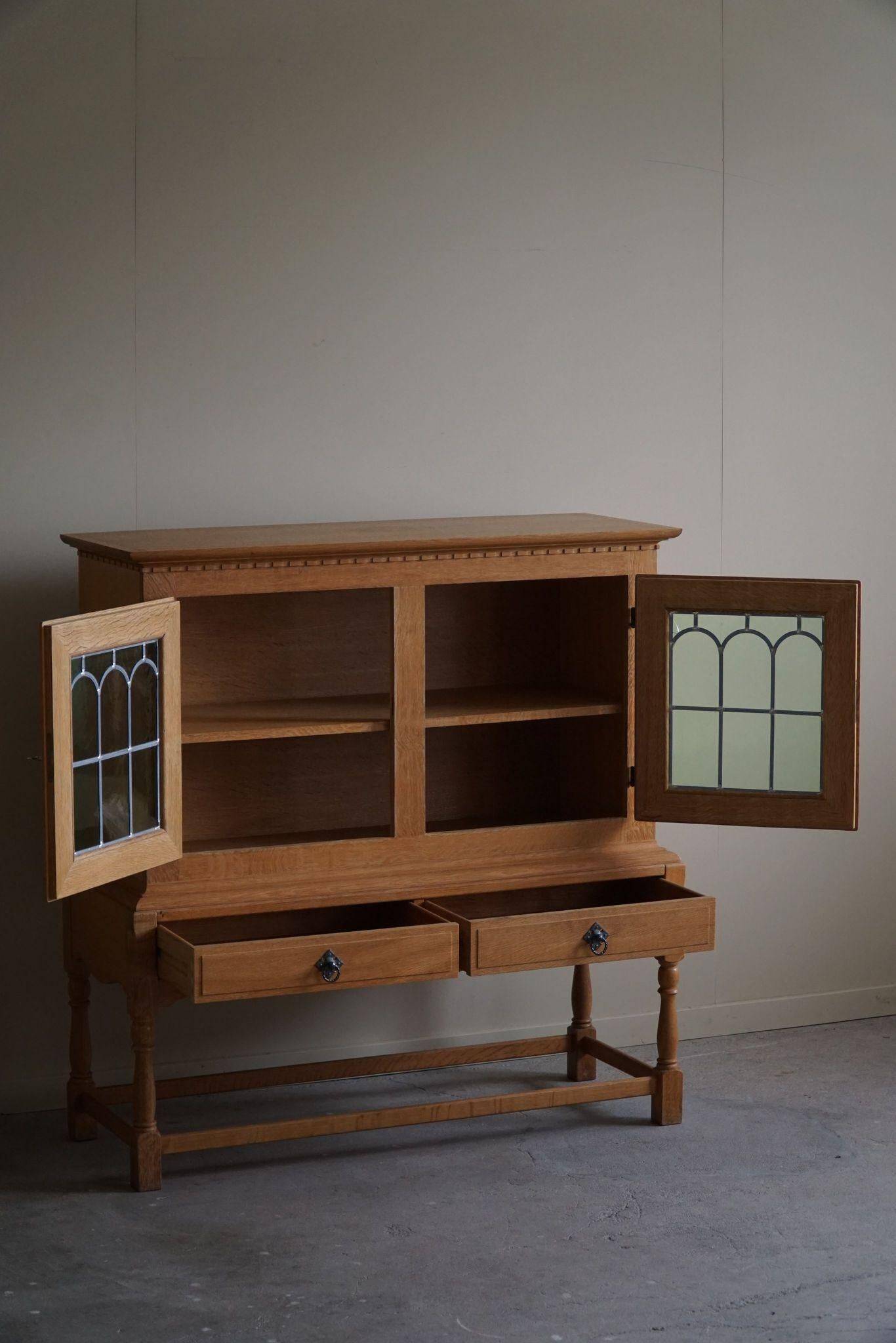 20th-century solid oak display cabinet with a glass front, by a Danish cabinetmaker.