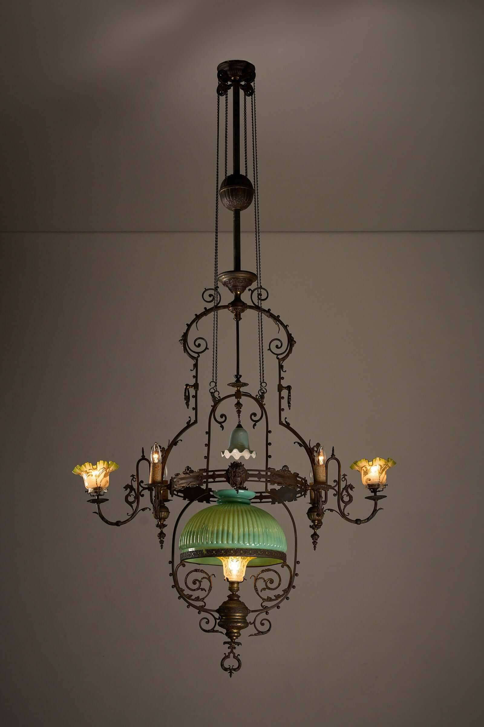 Antique adjustable height chandelier with original glasswork and brass detailing
