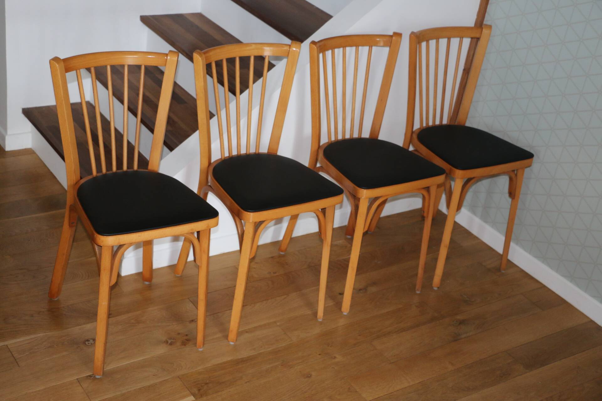 4 BAUMANN N°12 chairs in black skai and light beech