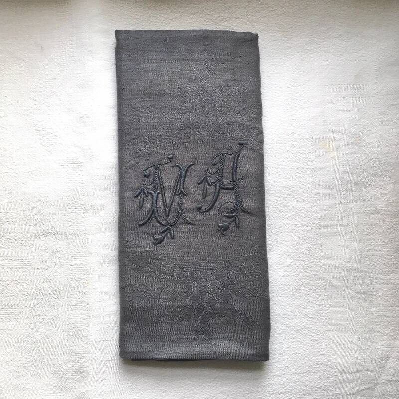 Old embroidered table napkin MA dark grey
