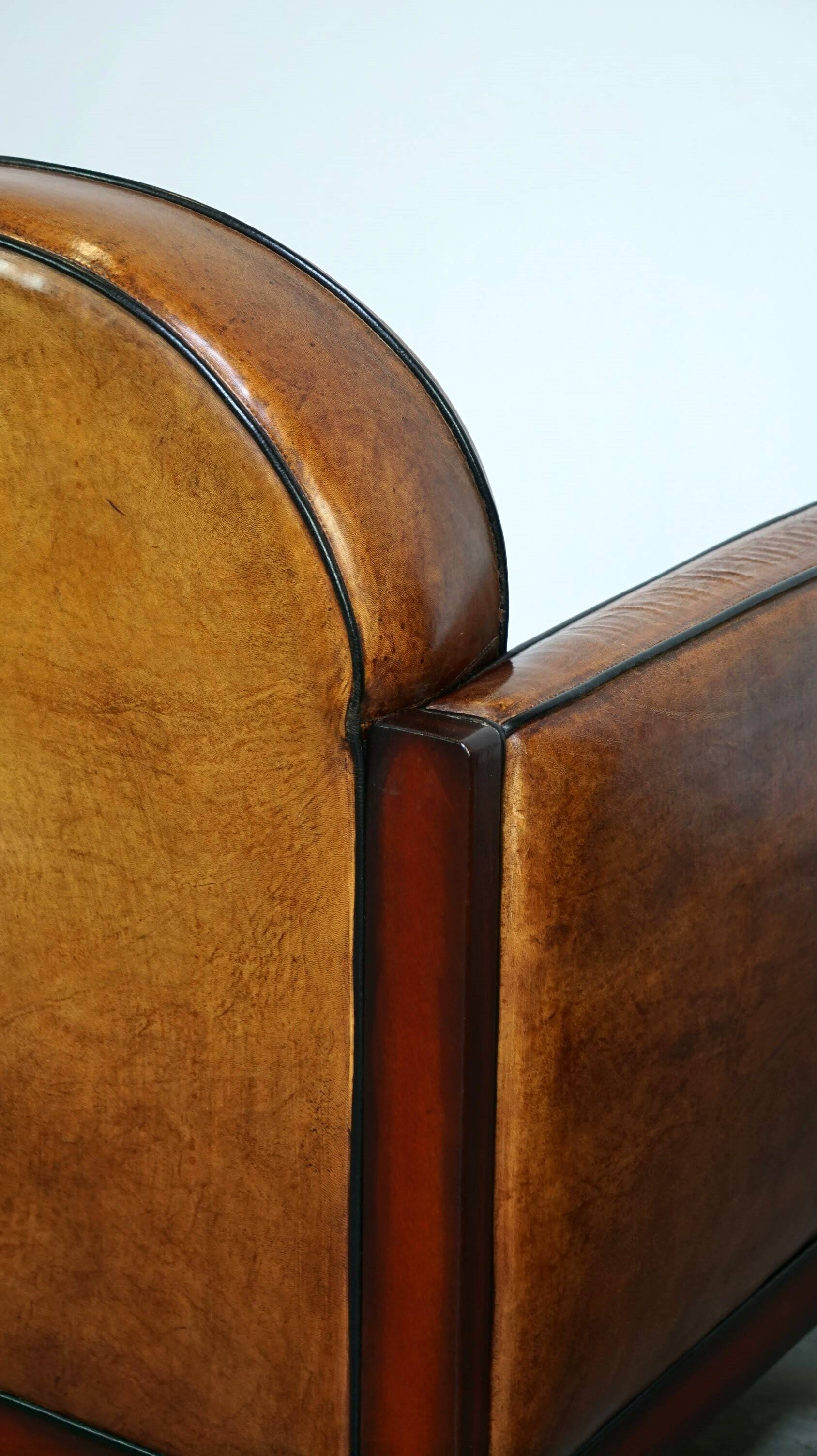 Sheepskin Art Deco design armchair with wood and beautiful cognac-colored leather