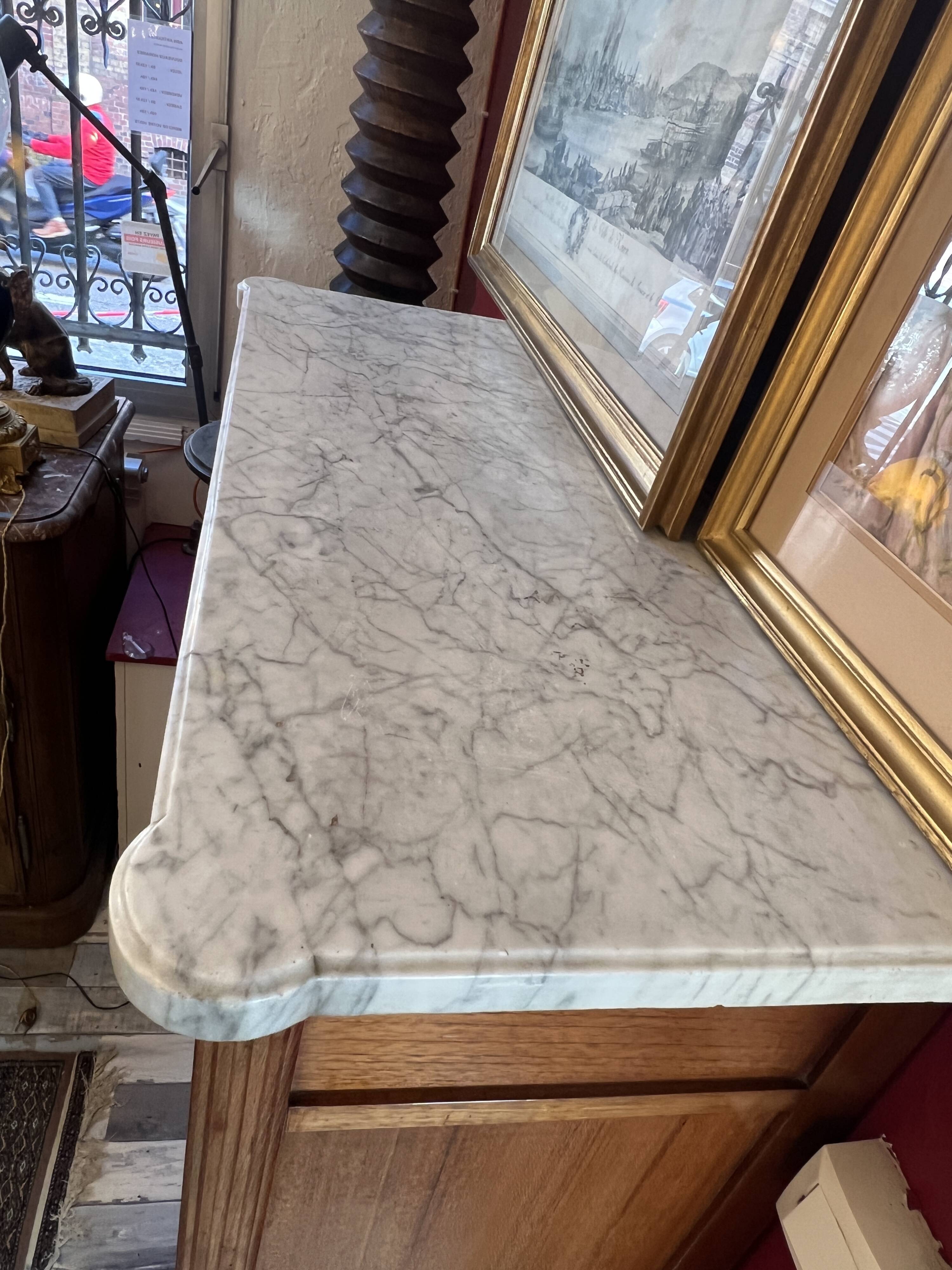 Louis XVI period mahogany secretary, white marble top, clover lock